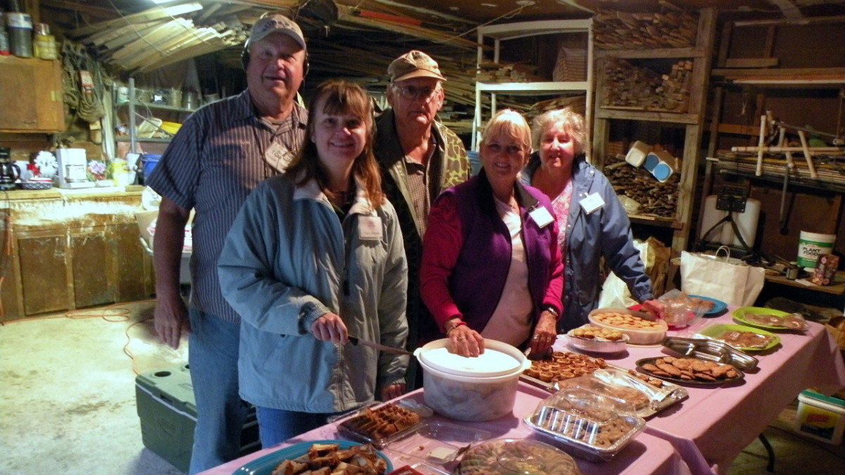 Glenn and Gloria Huddleston help serve refreshments at Tom Burseen's Iris Lab in Grand Prairie